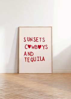 a poster with the words sunsets, cowboys and tequila on it in front of a white wall