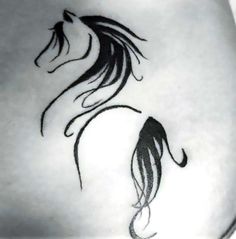 a black and white photo of a woman's stomach with a horse tattoo on it