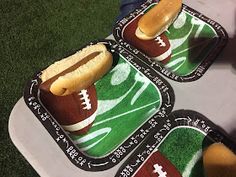 three trays with hot dogs and football themed napkins