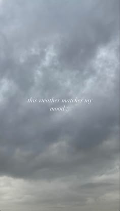 an airplane flying in the cloudy sky with words above it that read, this weather matches my mood