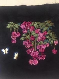 a painting of pink flowers and butterflies on a black background with white trimmings