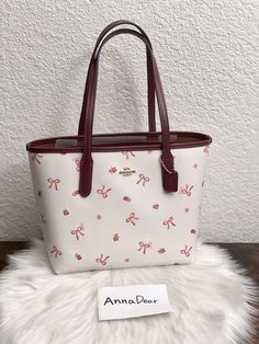 Coach Mini City Tote With Bow Tie Print Brand new with tags Color: Im/Chalk/Wine Multi 100% Authentic Limited Edition Product Details Printed coated canvas and smooth leather Inside snap pocket Handles with 7" drop 9" (L) x 8" (H) x 4 1/4" (W) Style No. CN681