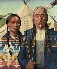 two native american indians standing next to each other