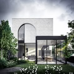 an artist's rendering of a house in the middle of a garden with white flowers