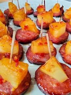 pineapple and bacon appetizers with toothpicks on them