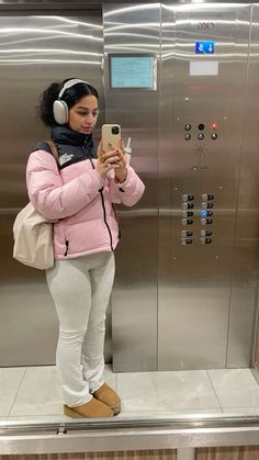 Ugg platforms, longchamp, pink northface puffer, silver airpod max, stanley cup, skims flares, clean girl, aesthetic North Face Puffer Coat Outfit, Platform Ugg Mini Outfit, Airpod Maxes Aesthetic, Pink Airpod Max Aesthetic, Pink Puffer Outfit, Northface Jacket Outfits, Edikted Outfit Aesthetic, Airpod Max Outfit, Pink Uggs Outfit