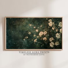 a painting hanging on the wall above a vase with flowers in it and an inscription that reads,'timeless aura prints by prathmush gupte