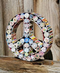 a peace sign made out of beer cans