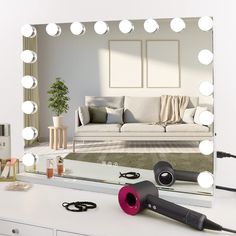 a living room with a mirror and hair dryer on the table in front of it