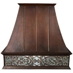 an old fashioned copper range hood with intricate designs on the front and side panels, against a white background