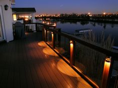 the deck is lit up with candles and lights