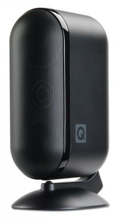 a black speaker on top of a stand