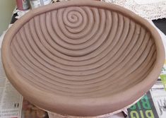 a brown bowl sitting on top of a table