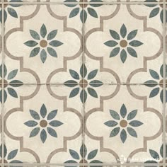 an artistic tile design with blue and brown flowers on white ground, in the middle of a tiled floor