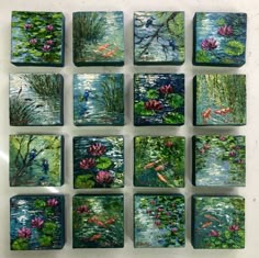 nine square tiles with water lilies and fish in them on a white table top