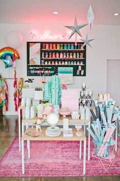 a room filled with lots of different items on top of a pink carpeted floor