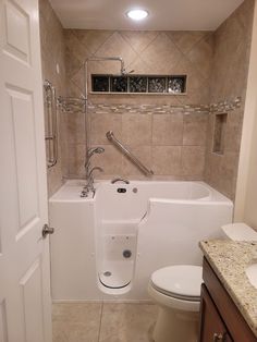 a bathroom with a tub, toilet and sink in the shower stall is seen here