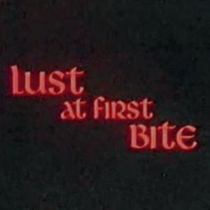 the words just at first bite are lit up in red on a black background,