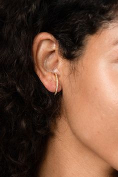 "Stand out from crowd with this Pave Bar Huggie Earring, Suspender Hook Jewelry, gold curved Earrings! Dainty, chic and compliments any style Each piece is handmade and crafted in our atelier just for you!    Made from 925 Sterling Silver with options of 14K Gold and Rose Gold Vermeil.   Feel free to message me with any questions or for more details! We love hearing from you! :)   Jewelry pouch included with purchase. At Evva's handmade shop we know you'll find something lovely for yourself or to give as a gift to someone special! CURRENT PRODUCTION TIMES All items are handmade and made to order so please check our policies page for the most up to date production and delivery times. If you need it sooner, please send us a message on Etsy, we can prepare your item as fast as possible for yo Suspender Earrings, Huggie Earring, Earrings Dainty, Hook Earrings, Huggies Earrings, Jewelry Pouch, Behind Ear Tattoo, Jewelry Gold, Wedding Earrings