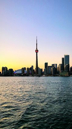 the city skyline is seen from across the water