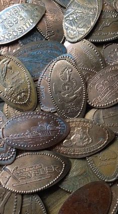 a pile of old coins sitting on top of each other