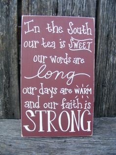 a sign that says in the court our tea is sweet, our words are long, our days are warm and our faith is strong