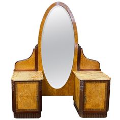 an art deco vanity with mirror and stools