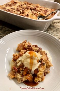 a white plate topped with dessert next to a casserole dish