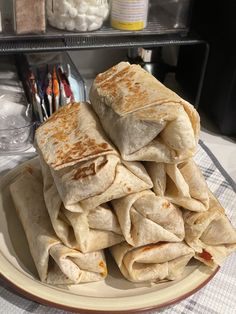 there is a plate full of tortillas on the table