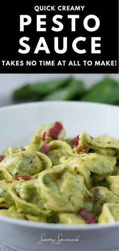 a white bowl filled with pesto sauce on top of a table