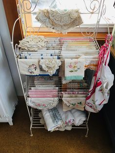 an ironing rack with many different items on it