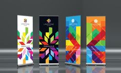 three roll up banners with different colors and shapes on the front, back and sides