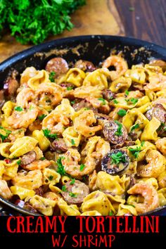 creamy tortellini with shrimp and mushrooms in a skillet