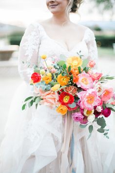 the instagram page shows an image of a bride holding a bouquet of colorful flowers