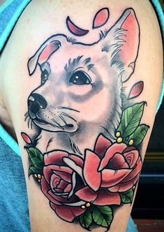 a woman's arm with a dog and roses on it