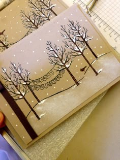 a handmade christmas card with trees on it