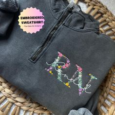 Comfort Colors Embroidered floral nurse quarter zip sweatshirt! Perfect for nursing graduation gift and nurses week! PLEASE NOTE: If no thread color is provided, we will default to black or white thread. Embroidery Design is approximately 5 X 2.25 inches for RN, RT, and DO designs but varies depending on credentials and name input Listing Photos:       Pepper Quarter Zip      Credentials(RN)       Name: Black Thread            Check out our Neutral Floral Embroidered Sweatshirt! https://theoakso Nurse Embroidery Designs, White Thread Embroidery, Nurse Design, Floral Sweatshirt, Nurse Graduation Gift, Nurses Week, Nursing Graduation, Embroidery Sweatshirt