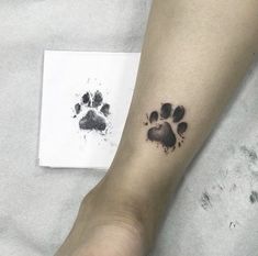 a person's foot with a paw print on it