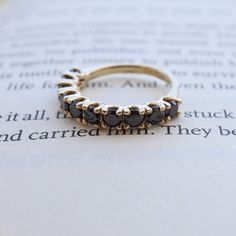 a close up of a ring on top of an open book