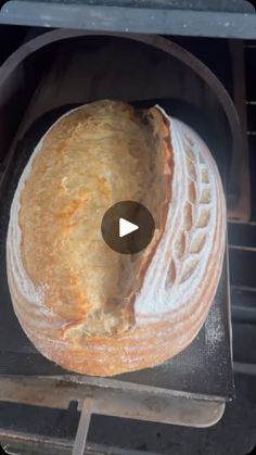 an uncooked loaf of bread is being cooked in the oven with a video