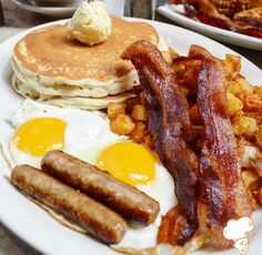 breakfast plate with bacon, pancakes and hash browns