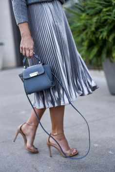 Tiffany Jais a Houston style blogger is wearing a metallic pleated skirt by ASOS with a chunky sweater and a ZAC Zac Posen bag, for a holiday chic look | Houston Style, Metallic Pleated Skirt, Ladylike Style, Houston Fashion, Style Blogger, Zac Posen, Nyc Fashion, Pleated Midi Skirt, Chunky Sweater