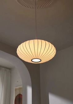 a light fixture hanging from the ceiling in a room