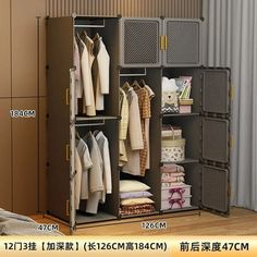 an open closet with clothes hanging on the rack and other items in front of it