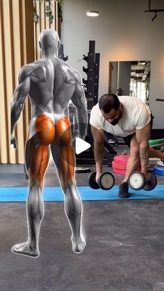 a man is doing exercises with dumbbells in the gym while another man looks on