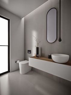 a modern bathroom with white walls and flooring