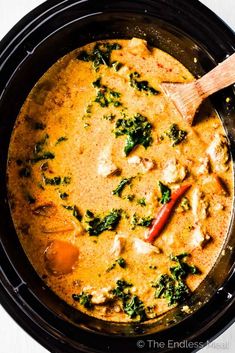 a bowl filled with chicken and spinach soup