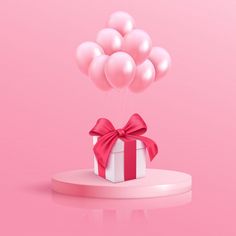 a present box with pink balloons and a red bow on it is floating in the air