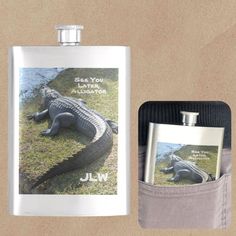 a flask bottle with an alligator in it next to a hippo's pocket