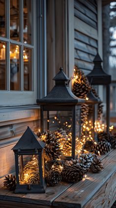 some pine cones and lights on a porch